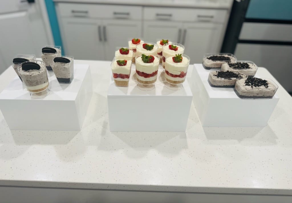Elegant dessert cups with strawberry cheesecake and oreo parfaits