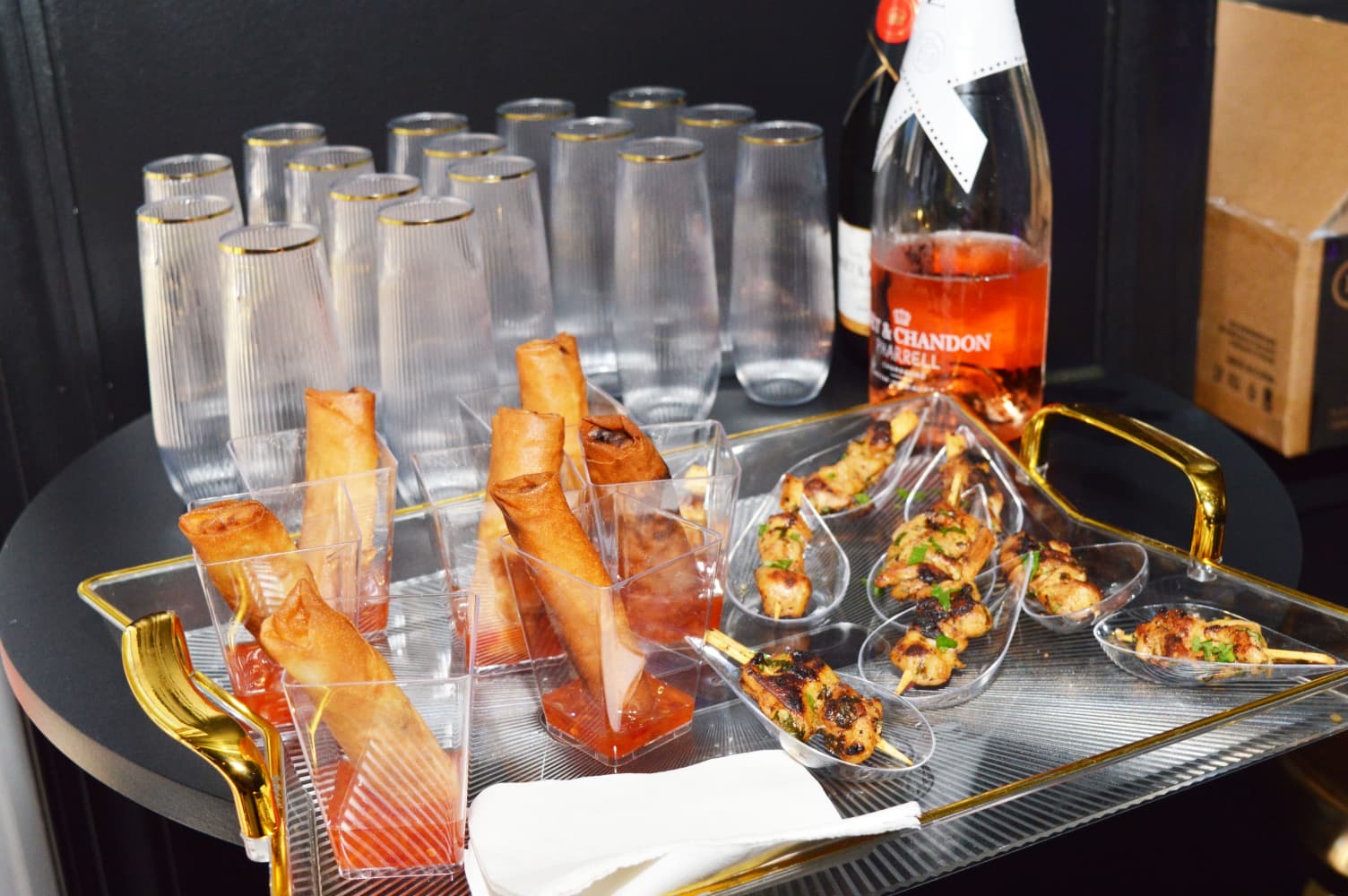 Crispy spring rolls and grilled chicken skewers